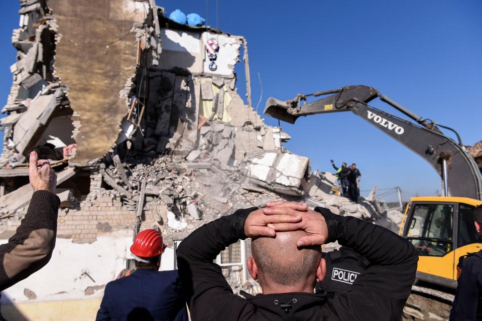 Rescue workers remove debris from a collapsed building in  Thumane, northwest of capital Tirana, after an earthquake hit Albania, on November 26, 2019. (Photo: Armend NimaniI/AFP via Getty Images)