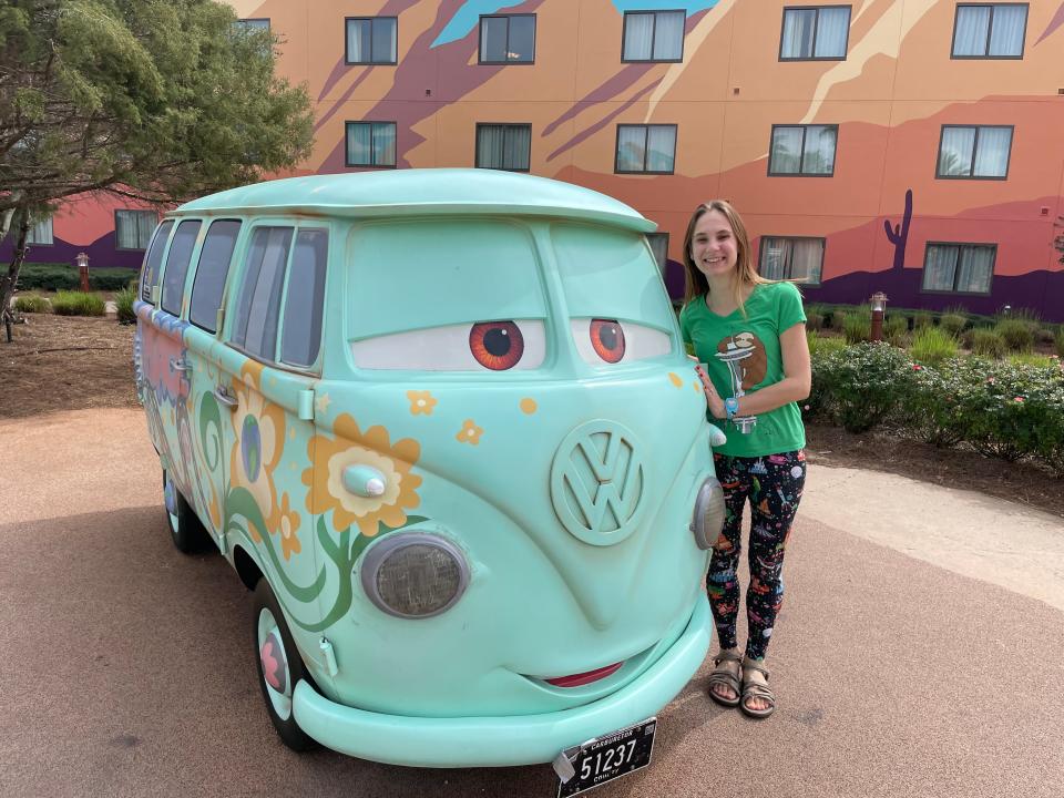 stacy posing with filmore from cars at disney's art of animation resort