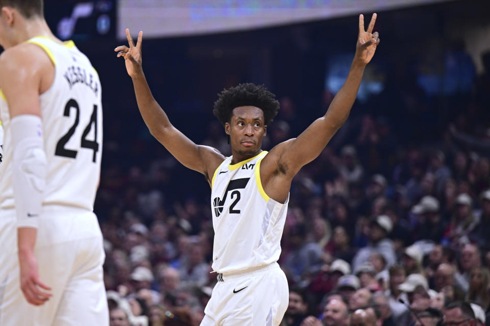 Utah Jazz guard Collin Sexton waves to fans after a video presentation on his career Cleveland Cavalier, during a first-quarter break in an NBA basketball game Wednesday, Dec. 20, 2023, in Cleveland. (AP Photo/David Dermer)