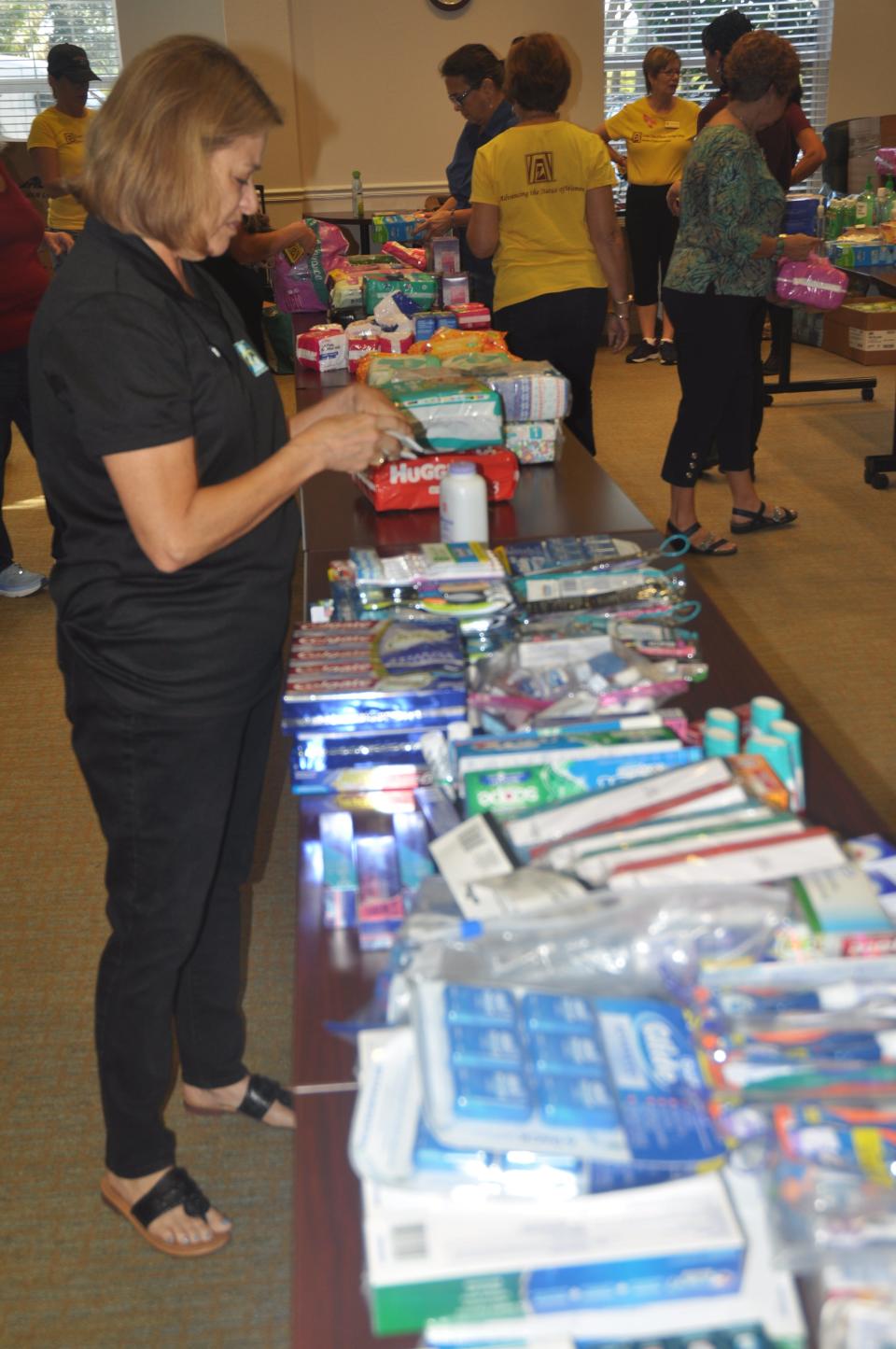 Carol Sissman, a member of the Zonta Club of Bonita Springs-Estero, packs supplies for victims of Hurricane Dorian in the Bahamas. The supplies had been collected from all over town. On Saturday, Nov. 16, 2019 volunteers met at the Bonita Springs Area Chamber of Commerce, to sort, pack and then send the donated items to the Bahamas.