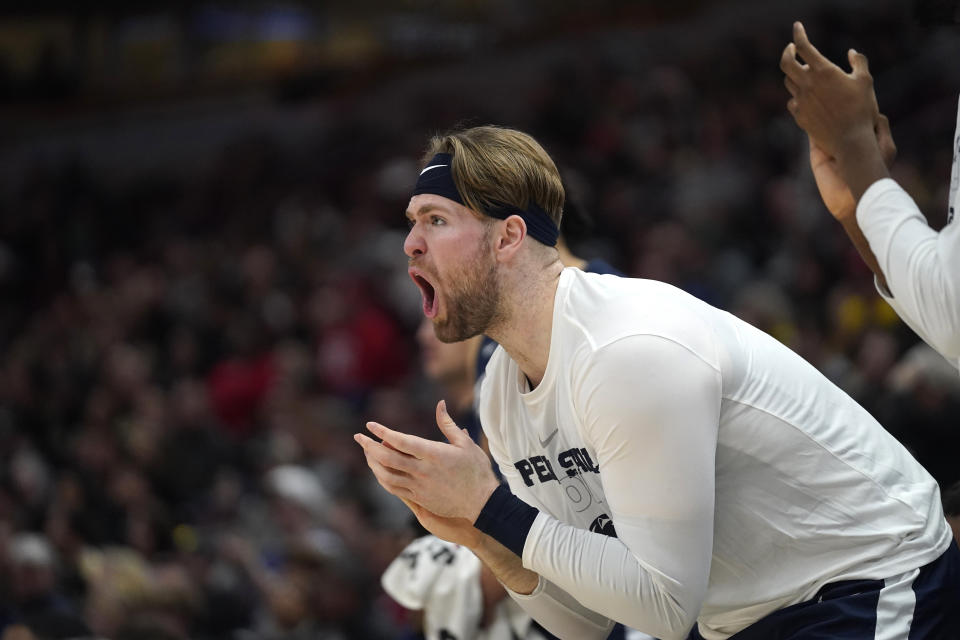 CORRECTS DAY/DATE TO SUNDAY, MARCH 12 INSTEAD OF SATURDAY, MARCH 11 - Penn State's Michael Henn cheers on his teammates during the first half of an NCAA college basketball championship game against Purdue at the Big Ten men's tournament, Sunday, March 12, 2023, in Chicago. (AP Photo/Erin Hooley)