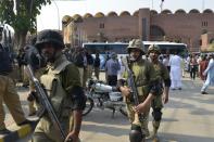 Pakistani soldiers gather for a rehearsal of security arrangements for the Zimbabwe team outside the Gaddafi Cricket Stadium in Lahore, on May 16, 2015
