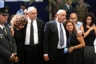 <p>Nechemia ‘Chemi’ Peres , center left, and Yoni Peres, center right, the sons of former Israeli President Shimon Peres, mourn with relatives during his funeral at the Mount Herzl national cemetery, Friday, Sept. 30, 2016. (Menahem Kahana, Pool via AP)</p>