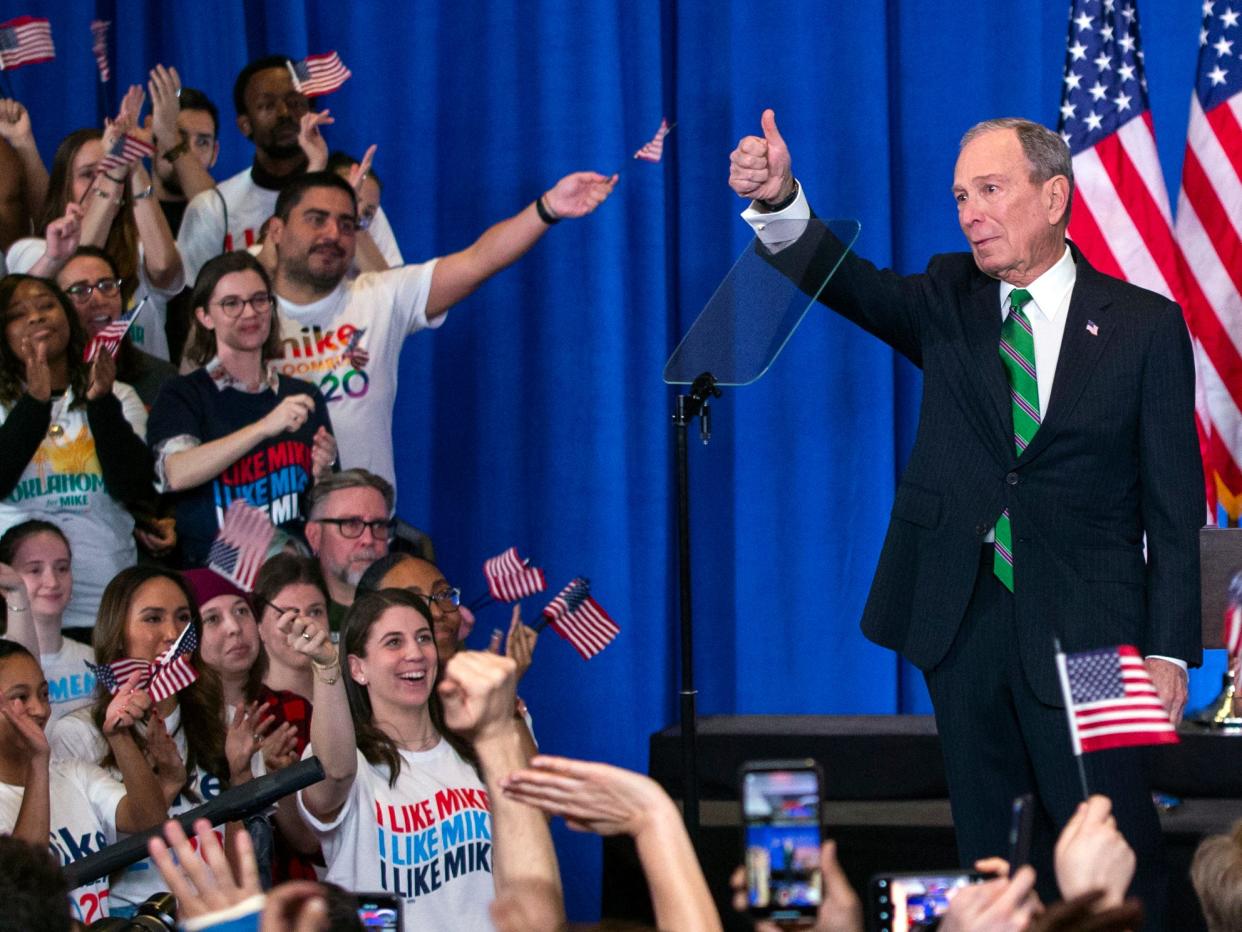 Former Democratic presidential candidate Mike Bloomberg gestures to supporters as he announces the suspension of his campaign and his endorsement of former Vice President Joe Biden for president in New York Wednesday , March 4, 2020. (AP Photo/Eduardo Munoz Alvarez)