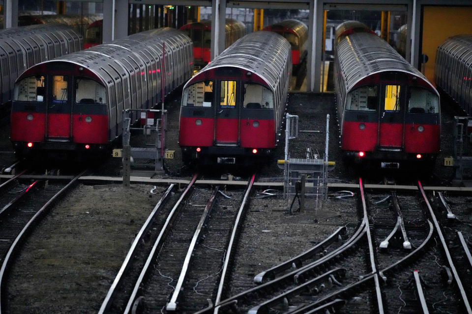 Piccadilly line trains sit in their depot as members of the Rail, Maritime and Transport union (RMT) continue nationwide strikes in a bitter dispute over pay, jobs and conditions in London, Friday, Aug. 19, 2022.(AP Photo/Frank Augstein)