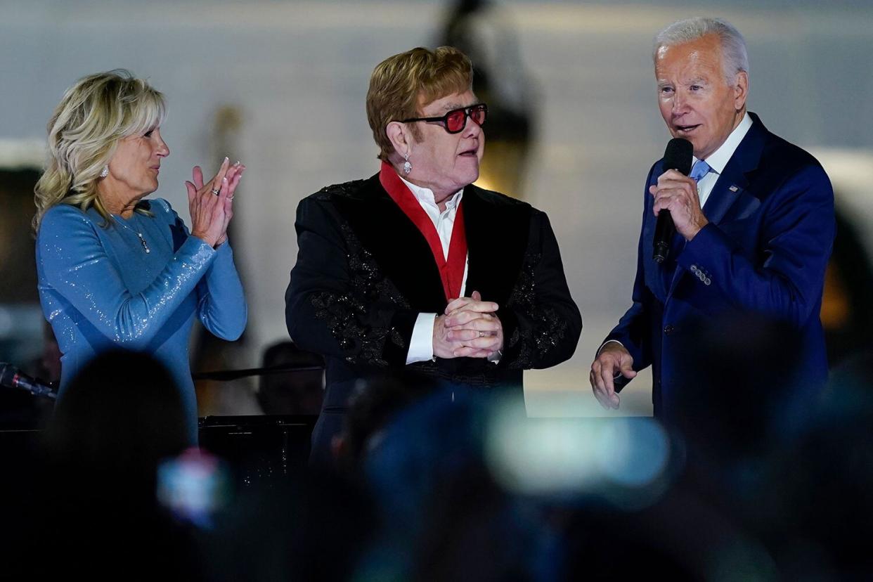 President Joe Biden speaks on the South Lawn of the White House in Washington, after presenting Elton John with the National Humanities Medal, as first lady Jill Biden listens Biden White House Elton John, Washington, United States - 23 Sep 2022