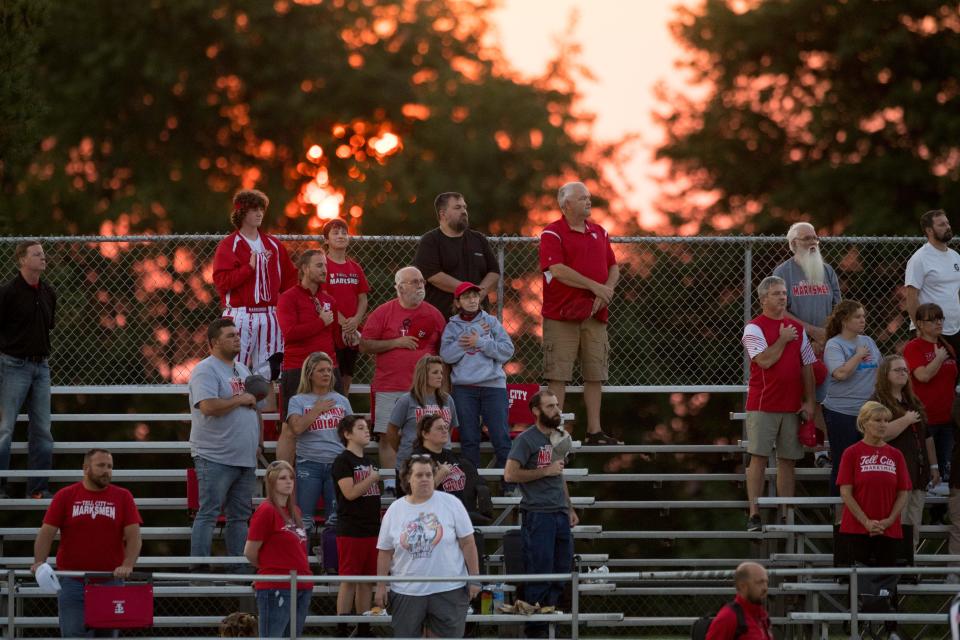 Tell City Marksmen fans stand for the National Anthem ahead of the North Posey Vikings vs Tell City Marksmen game at North Posey High School Friday evening, Sept. 10, 2021.