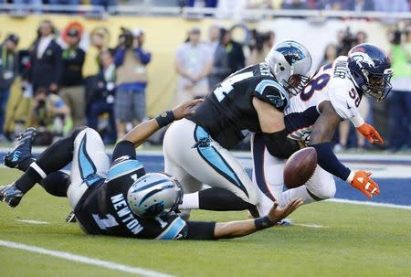 Carolina Panthers' quarterback Cam Newton loses the ball after being sacked by Denver Broncos' Von Miller (58) as Panthers' Mike Remmers tries to block as the play lead to a recovered fumble in the end zone for a touchdown by Denver in the first quarter during the NFL's Super Bowl 50 football game in Santa Clara, California February 7, 2016. REUTERS/Mike Blake