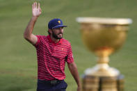 Max Homa walks to the 15th green after the USA team won the singles match at the Presidents Cup golf tournament at the Quail Hollow Club, Sunday, Sept. 25, 2022, in Charlotte, N.C. (AP Photo/Chris Carlson)