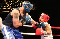 <p>New York’s Finest Paul Altimore tags Luis Rodriguez during the NYPD Boxing Championships at the Theater at Madison Square Garden on June 8, 2017. (Photo: Gordon Donovan/Yahoo News) </p>