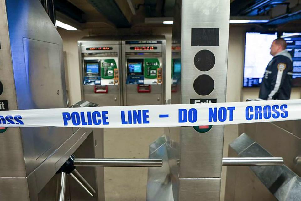 <p>New York Police Department via AP</p> Police tape on the Mount Eden subway station