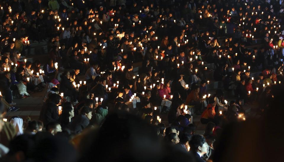 Students from Danwon high school and others attend at a candlelight vigil to wish for the safe return of missing passengers from the sunken South Korean ferry Sewol, at a park in Ansan