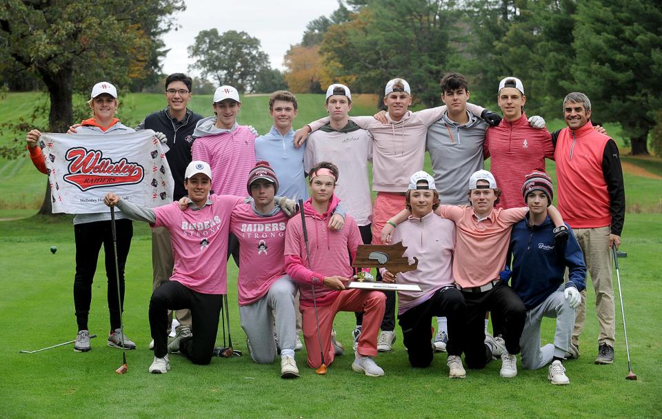 The Wellesley High School golf team with their runner-up Div. 1 state trophy at Nehoiden Golf Club, October 28, 2021. Standing from left: Lincoln Blake, Andrew Ng, Ben Madden, Ryan Keyes, Tyler McChesney, Owen Blakely, Tyler Collins, Sean Tavis, and coach Ken Bateman. Kneeling from left: Simon Murray, Robbie Marshall, Michael Votapka, Cole Adams, Tubey Kelleher, Brian Campbell.