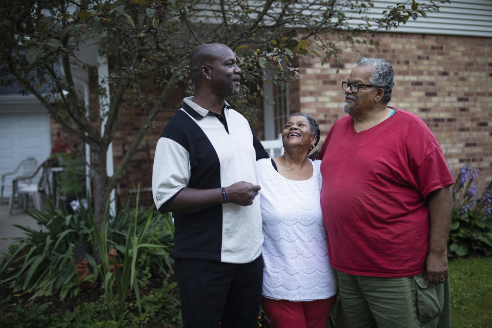 Image: Reid, left, with his mother Marion Holly and her husband Luther in Alliance, Ohio, on July 17, 2021. (Maddie McGarvey / for NBC News)