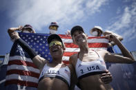 April Ross, left, of the United States, and teammate Alix Klineman celebrate winning a women's beach volleyball Gold Medal match against Australia at the 2020 Summer Olympics, Friday, Aug. 6, 2021, in Tokyo, Japan. (AP Photo/Felipe Dana)