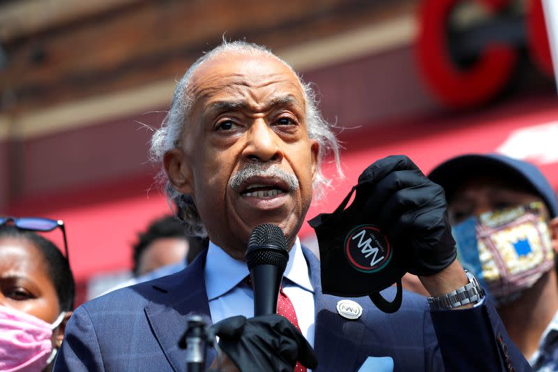 Civil rights leader Reverend Al Sharpton leads a prayer at the site where African-American man George Floyd was fatally injured by police in Minneapolis