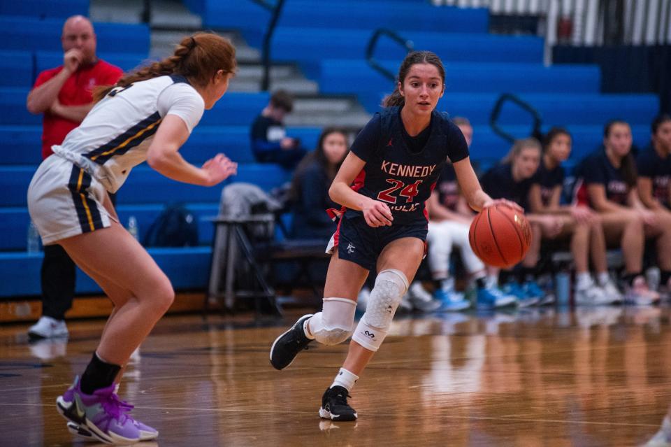 Kennedy's Cali Arigale drives by a Lourdes defender during the girls basketball game at Our Lady of Lourdes High School in Poughkeepsie, NY on Saturday, December 9, 2023. Loudes defeated Kennedy 65-38. KELLY MARSH/FOR THE POUGHKEEPSIE JOURNAL