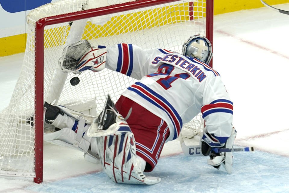 New York Rangers goaltender Igor Shesterkin watches the puck go past him for a goal by Boston Bruins left wing Jake DeBrusk (74) in the second period of an NHL hockey game, Thursday, May 6, 2021, in Boston. (AP Photo/Elise Amendola)