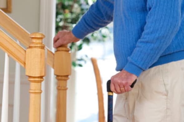 BPHGRW Man suffering from Parkinson's disease and multiple sclerosis standing near steps