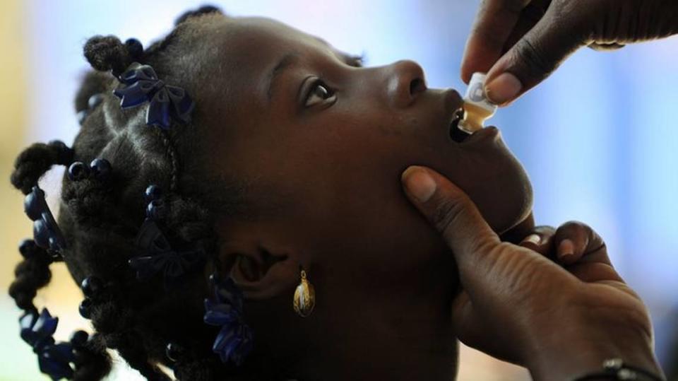 A child receives a dose of the vaccine against cholera in Saut d’Eau, Haiti.