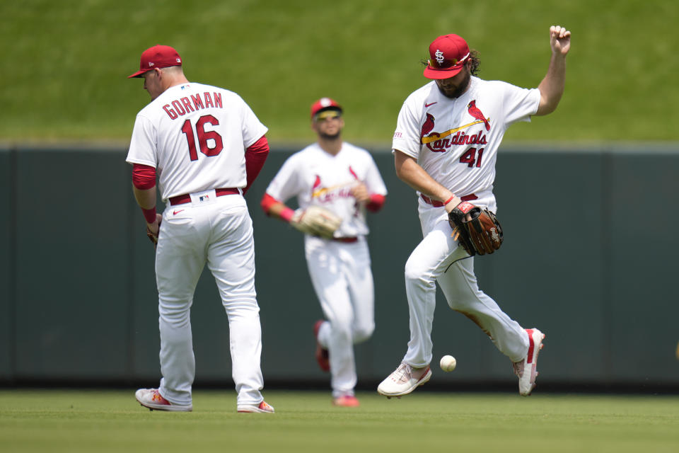 St. Louis Cardinals right fielder Alec Burleson (41) is unable to catch a single by Miami Marlins' Jorge Soler as teammates Nolan Gorman (16) and Dylan Carlson watch during the third inning of a baseball game Wednesday, July 19, 2023, in St. Louis. (AP Photo/Jeff Roberson)