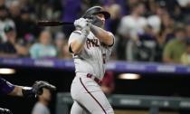 Arizona Diamondbacks pinch-hitter Daulton Varsho watches his two-run home run off Colorado Rockies relief pitcher Jhoulys Chacin during the ninth inning of a baseball game Saturday, July 2, 2022, in Denver. (AP Photo/David Zalubowski)