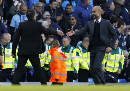 Britain Soccer Football - Manchester City v Southampton - Premier League - Etihad Stadium - 23/10/16 Manchester City manager Pep Guardiola shakes hands with Southampton manager Claude Puel after the game Action Images via Reuters / Craig Brough Livepic