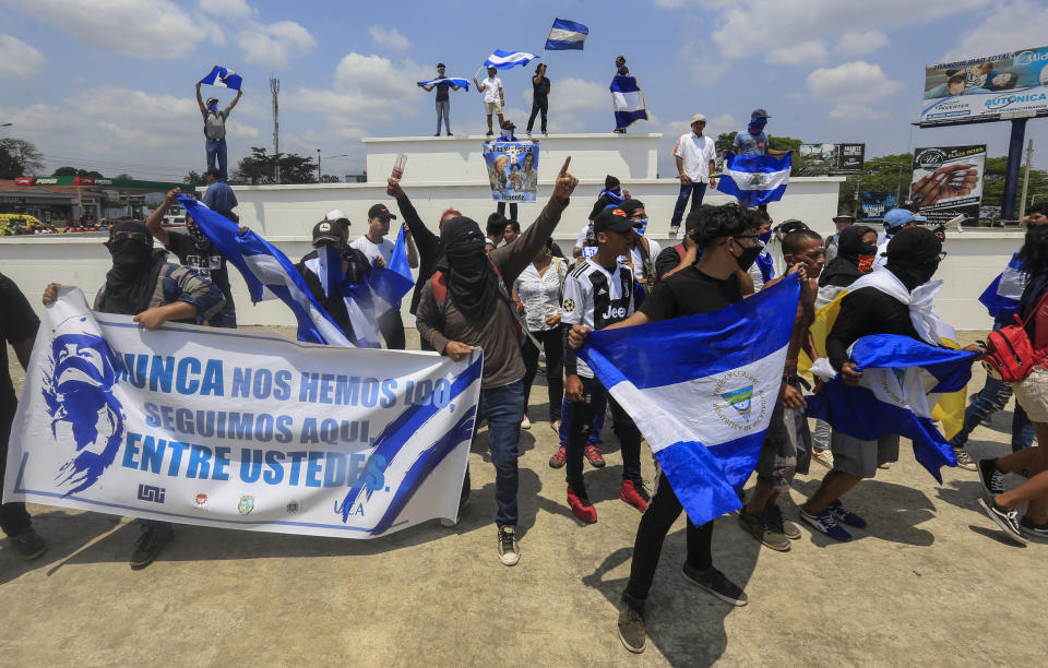 Anti-government protesters join a Stations of the Cross procession on Good Friday, in Managua, Nicaragua, Friday, April 19, 2019. Good Friday religious processions in Nicaragua’s capital have taken a decidedly political tone as people have seized on a rare opportunity to renew protests against the government of President Daniel Ortega. (AP Photo/Alfredo Zuniga)