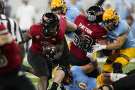 CORRECTS ID TO ANTARIO BROWN NOT JAMES ESTER - Northern Illinois' Antario Brown rushes during the first half of an NCAA college football game against Kent State, Saturday, Dec. 4, 2021, in Detroit. (AP Photo/Carlos Osorio)