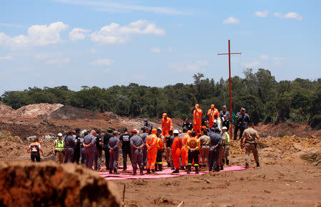 Rescue workers attend a mass for victims victims of a collapsed tailings dam owned by Brazilian mining company Vale SA, in Brumadinho, Brazil February 1, 2019. REUTERS/Adriano Machado