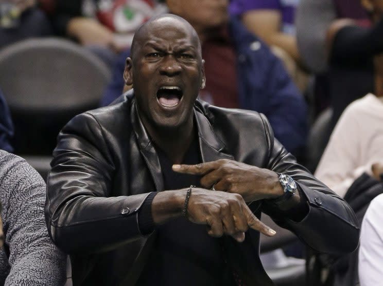 Michael Jordan shows the Warriors where rings go. (AP)