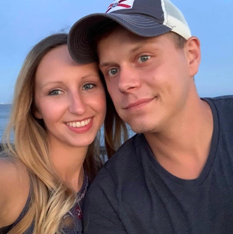 Audrey and Josh Williams pose for a photograph together. The couple's son recently rescued Josh from the water at Quietwater Beach after a diving accident.