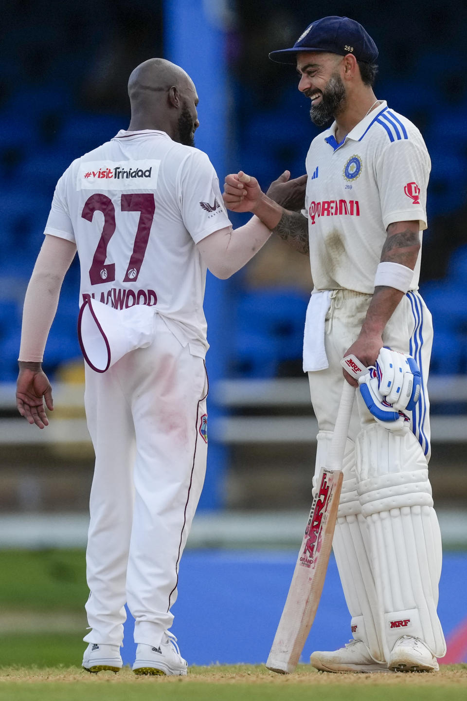 India's Virat Kohli, not out for 87 runs, greets West Indies' Jermaine Blackwood at the end of day one of their second cricket Test match at Queen's Park in Port of Spain, Trinidad and Tobago, Thursday, July 20, 2023. (AP Photo/Ricardo Mazalan)