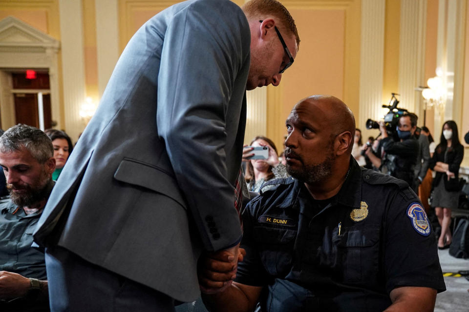 Stephen Ayres, January 6 rioter, speaks to Harry Dunn, U.S. Capitol Police officer, following testimony before the House Select Committee to investigate the January 6 Attack on the U.S. Capitol, in Washington, on July 12.<span class="copyright">Sarah Silbiger—Reuters</span>