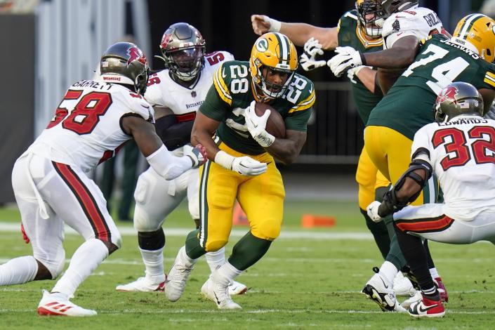 Green Bay Packers' AJ Dillon runs during the second half of an NFL football game against the Tampa Bay Buccaneers Sunday, Sept. 25, 2022, in Tampa, Fla. (AP Photo/Chris O'Meara)