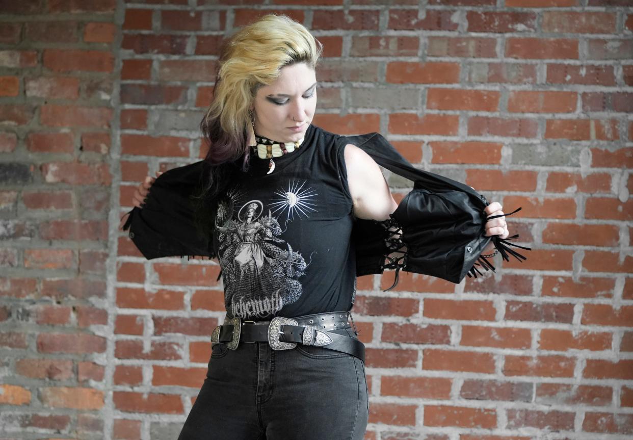 July 16, 2022; Columbus, Ohio, USA;  Willow Richison (they/them), of Columbus, sheds a black leather jacket during their photo shoot at Stonewall Columbus in July. "Being trans to me is to transform into the most honest version of my soul with my physical body."Mandatory Credit: Barbara J. Perenic/Columbus Dispatch