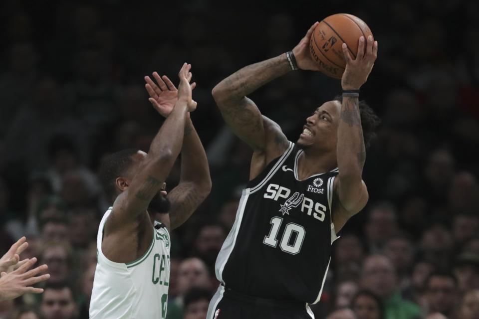 San Antonio Spurs guard DeMar DeRozan (10) shoots over Boston Celtics guard Brad Wanamaker, left, during the third quarter of an NBA basketball game Wednesday, Jan. 8, 2020 in Boston. (AP Photo/Charles Krupa)