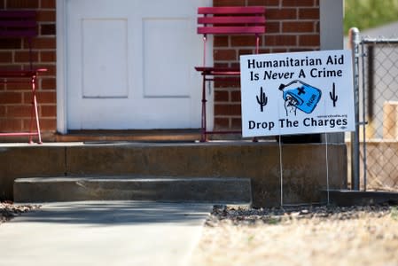 FILE PHOTO: A sign showing support is displayed in a neighborhood near the Evo A. DeConcini U.S. Courthouse, where humanitarian volunteer Scott Warren faces charges of harboring, and conspiracy to transport undocumented migrants in Tucson