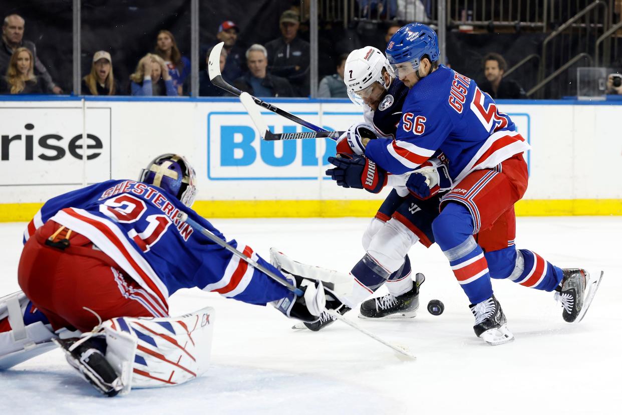 NEW YORK, NEW YORK - FEBRUARY 28: Sean Kuraly #7 of the Columbus Blue Jackets battles Erik Gustafsson #56 of the New York Rangers as Igor Shesterkin #31 of the New York Rangers makes a save during the third period at Madison Square Garden on February 28, 2024 in New York City. The Rangers won 4-1.