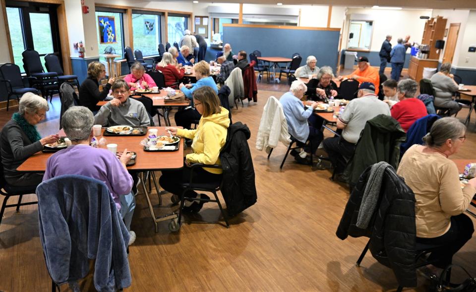 Seniors over 60 fill the Burnside Center commons room for congregate meal lunches.