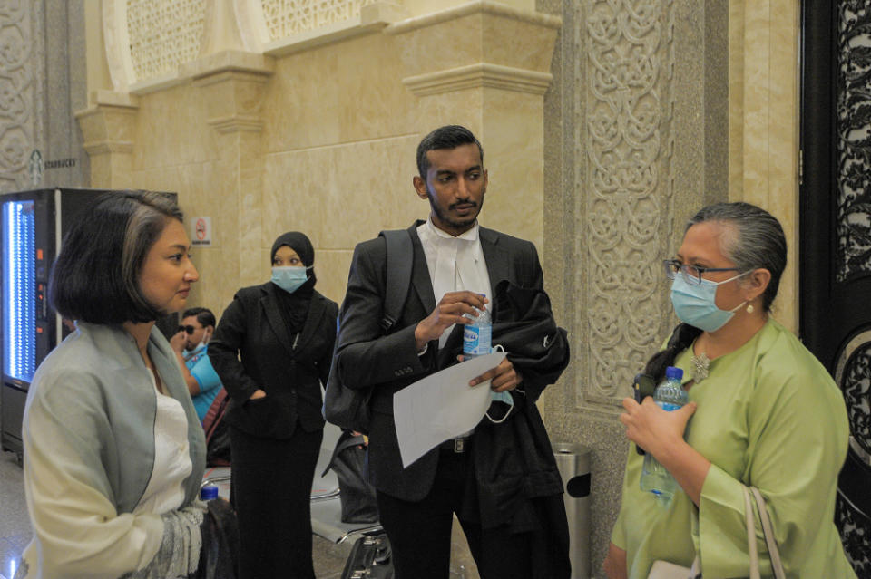 Lawyer Surendra Ananth (centre) with SIS executive director Rozana Isa and SIS programme manager Shareena Sheriff (right) are pictured at the Palace of Justice in Putrajaya, September 22, 2020. — Picture by Shafwan Zaidon