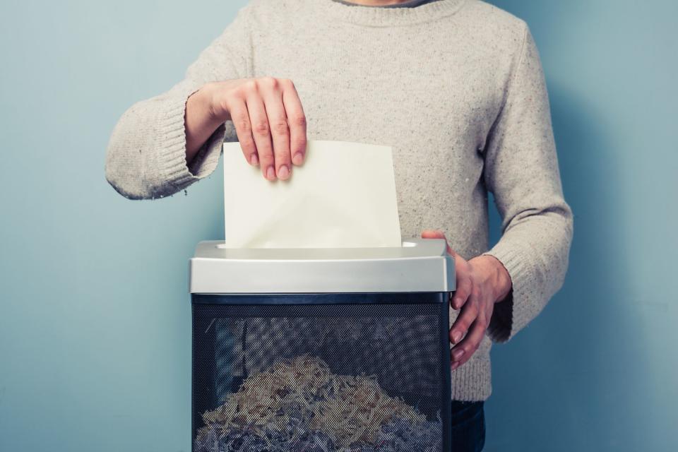 Person shredding paper