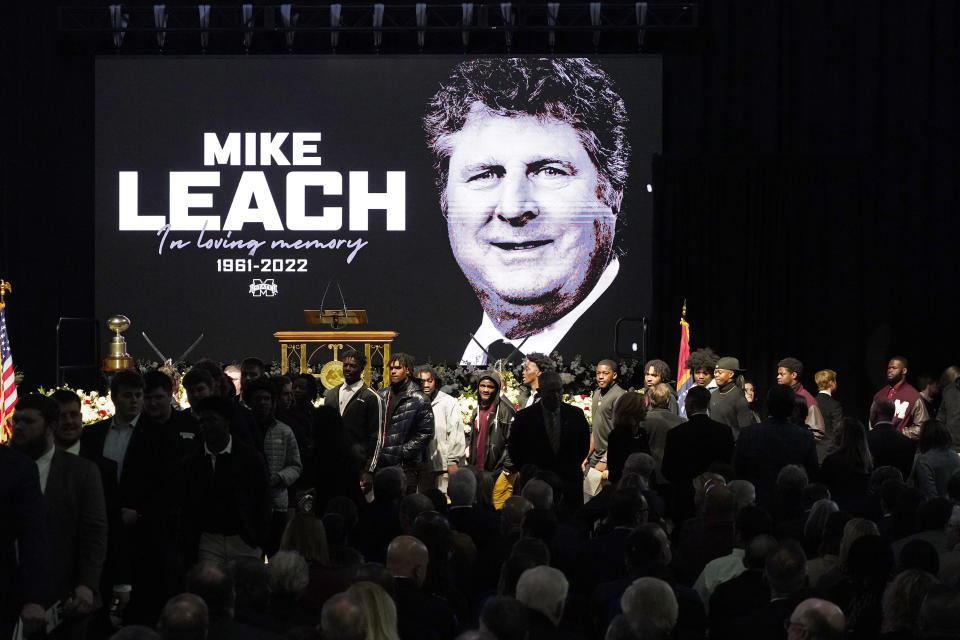 Current football players enter the memorial service for their late Mississippi State football coach Mike Leach, at Humphrey Coliseum on the university's campus in Starkville, Miss., Tuesday, Dec. 20, 2022. Leach died, Dec. 12, 2022, from complications related to a heart condition at 61. He was in his third year as head coach. (AP Photo/Rogelio V. Solis)