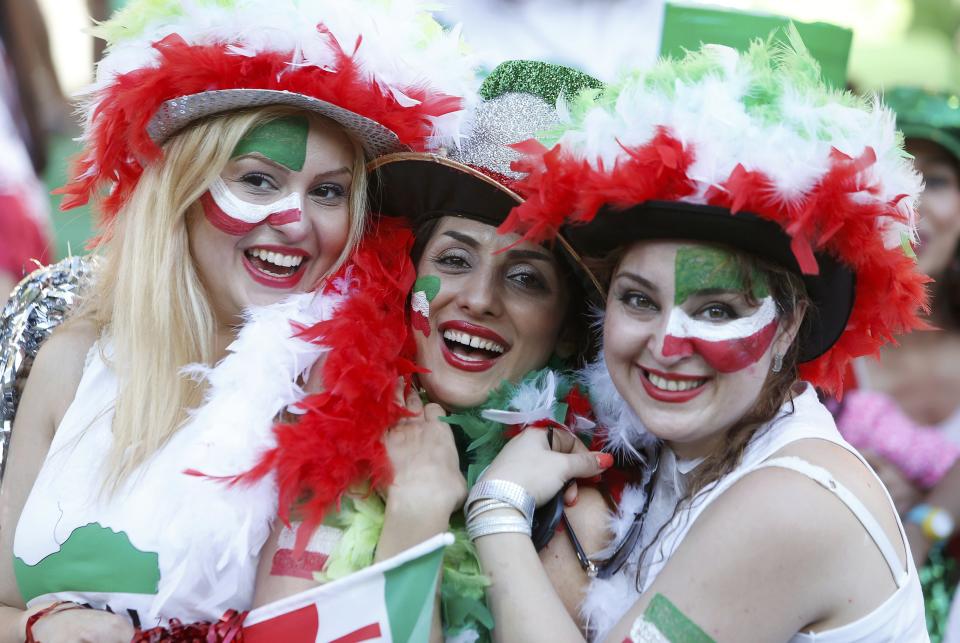 Iran supporters wearing colourful team colours smile before the Asian Cup Group C soccer match betweeen Iran and Bahrain at the Rectangular stadium in Melbourne