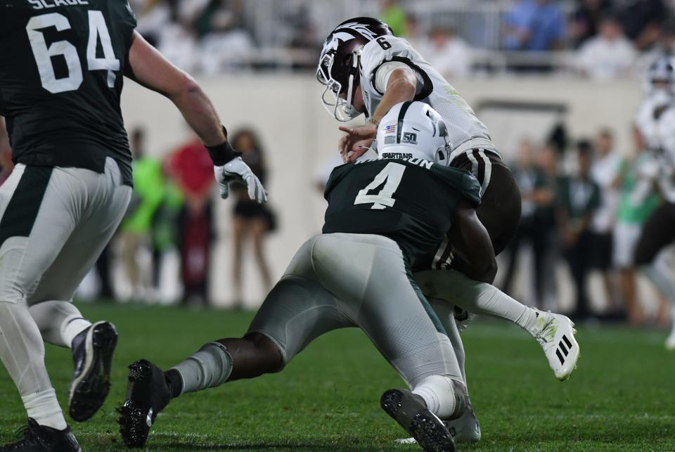 MSU LB Jacoby Windmon sacks WMU QB Jack Salopek  Friday, Sept. 2, 2022, during the season opener against Western Michigan at Spartan Stadium in East Lansing. Jacoby had four sacks.