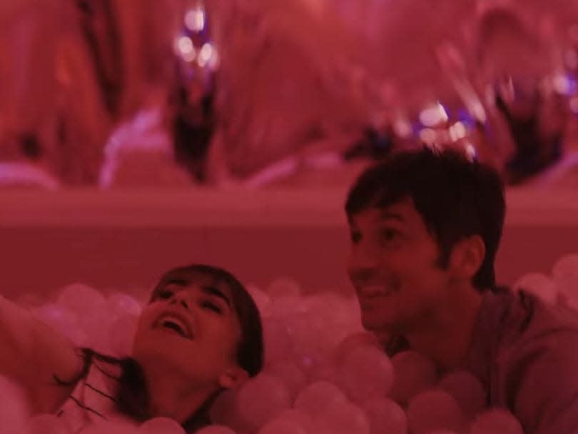 emily and gabriel in a ball pit on emily in paris season three episode seven