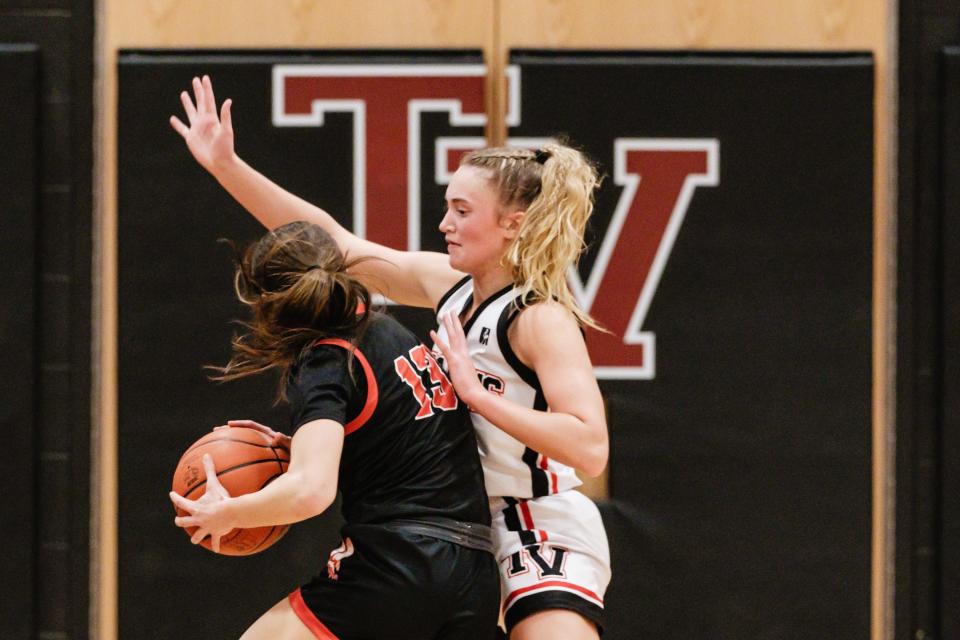 Hiland's Ashley Mullett, left, attempts two points as Tusky Valley's Leah Bourquin gaurds during a game, Monday, Jan. 29 at Tusky Valley Middle-High School in Zoarville.