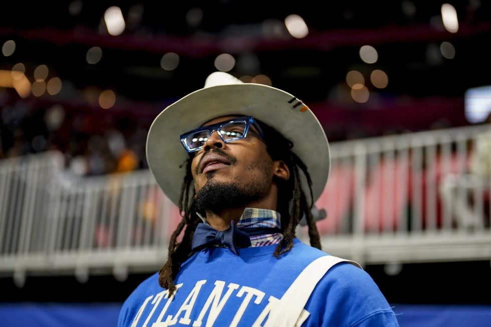 NFL football player Cam Newton watches play between Howard and Florida A&M during the first half of an NCAA Celebration Bowl football game, Dec. 16, 2023, in Atlanta. (AP Photo/Mike Stewart, File)