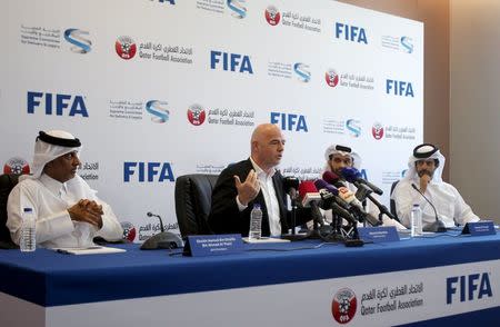 FIFA's newly elected president Gianni Infantino (C) speaks during a news conference in Doha, Qatar, April 22, 2016. REUTERS/Naseem Zeitoon