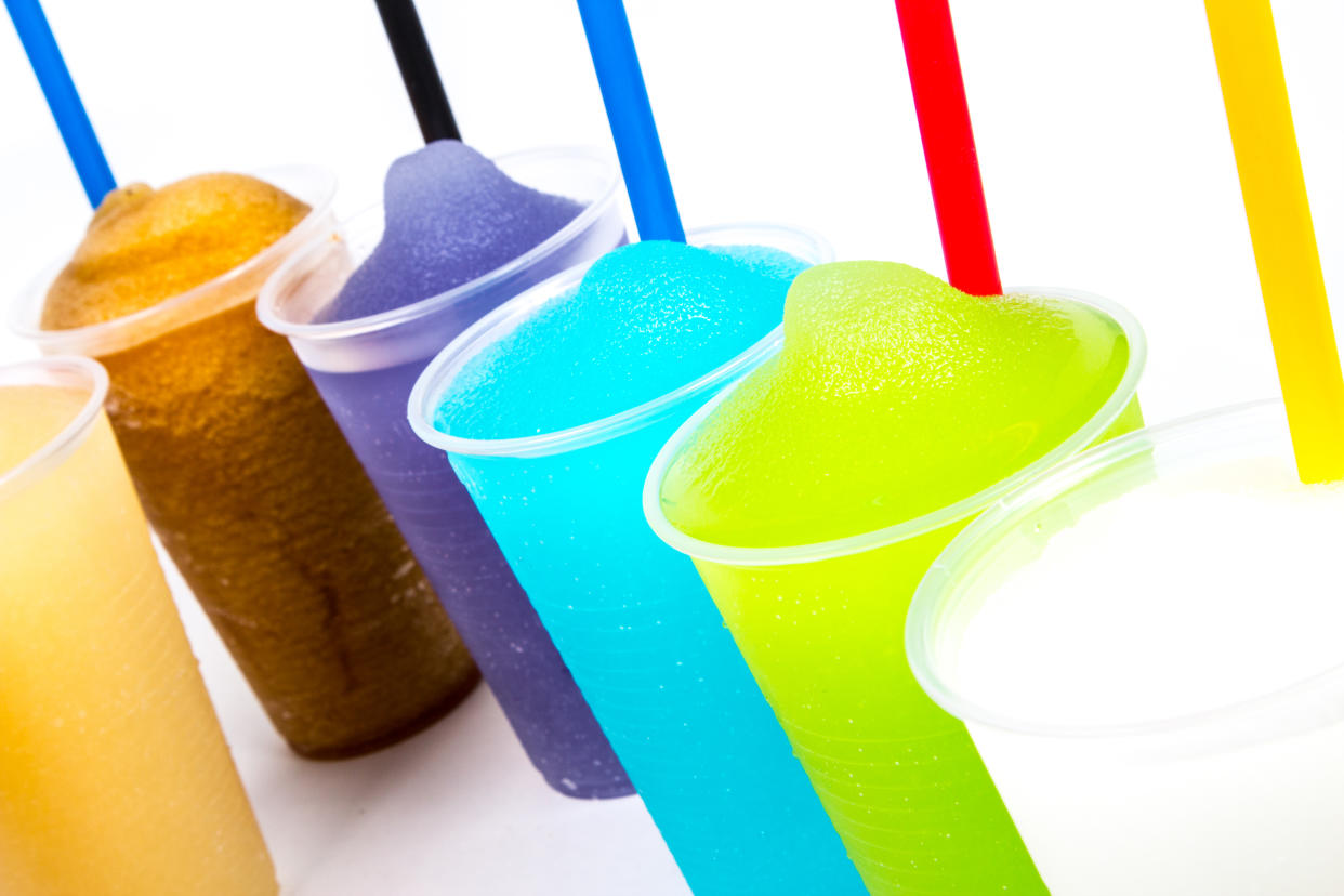 Colorful summer slushies on white background. amazon cup